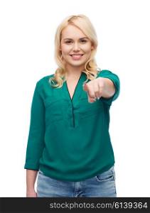 female, gender, gesture, plus size and people concept - smiling young woman in shirt and jeans pointing finger on you