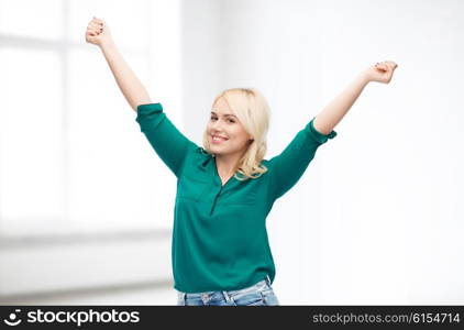 female, gender, joy, plus size and people concept - happy young woman in shirt and jeans over white room background