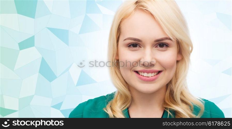 female, gender, portrait and people concept - smiling young woman face over blue low poly background