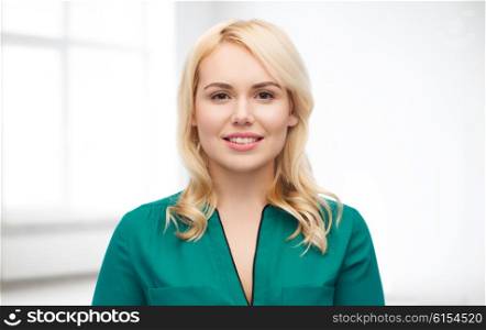female, gender, portrait and people concept - smiling young woman face over white room background