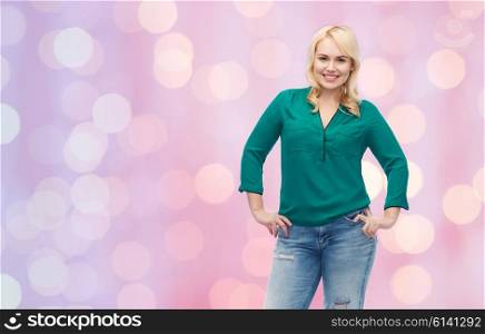 female, gender, portrait, plus size and people concept - smiling young woman in shirt and jeans over pink holidays lights background