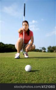 Female Golfer Concentrating