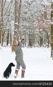 Female gun with labrador out on a snowy shoot