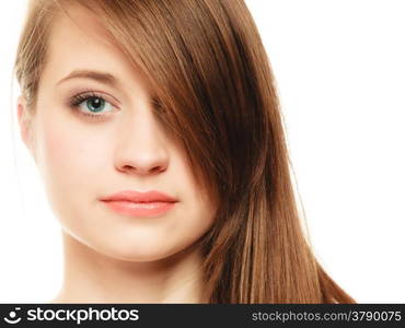 Female hairstyle. Portrait of girl with makeup and long bang covering her eye isolated on white.