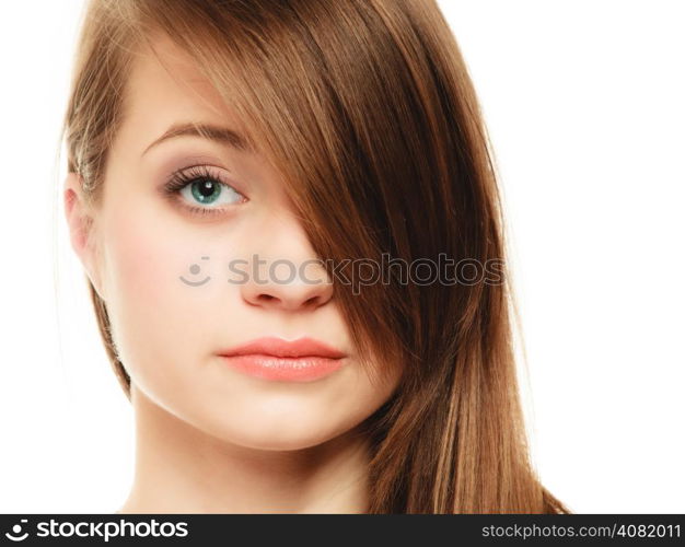 Female hairstyle. Portrait of girl with makeup and long bang covering her eye isolated on white.