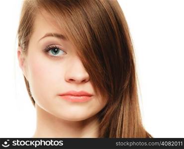 Female hairstyle. Portrait of girl with makeup and long bang covering her eye isolated on white.