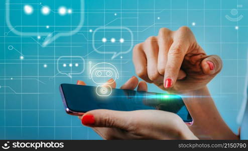 Female hand engaged in a chatting conversation with an automated digital chatbot. Image enhanced with graphic details. Female hand engaged in a chatting conversation with an automated digital chatbot.