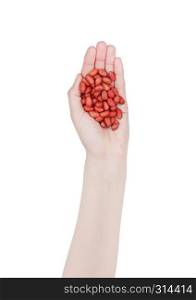 Female hand hold healthy bio red peanuts on white background