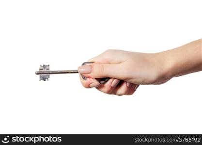 Female hand holding a key to the house, image is taken over a white background.