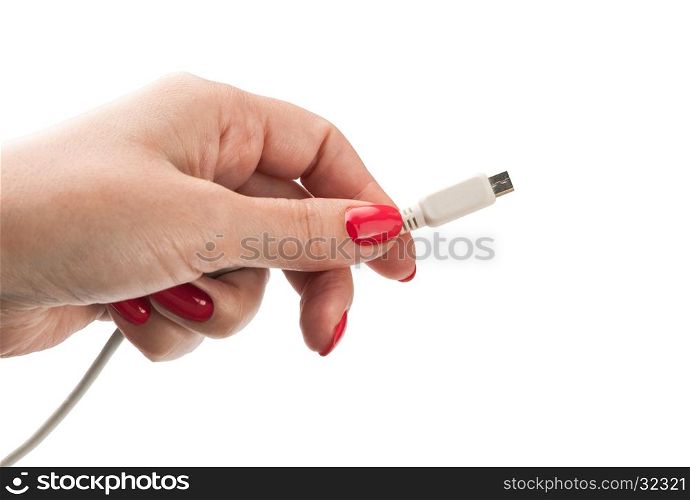 Female hand holding connector charger for mobile isolated on white background