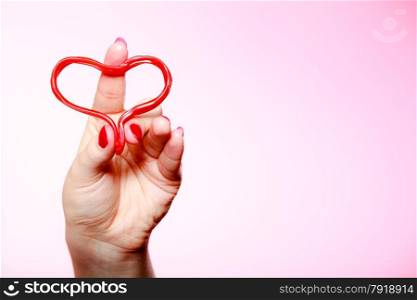 Female hand holding red heart love symbol. woman in love. Valentines day.