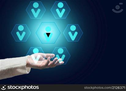 female hand on a dark background and the hierarchical structure of the team, effective management model in the organization