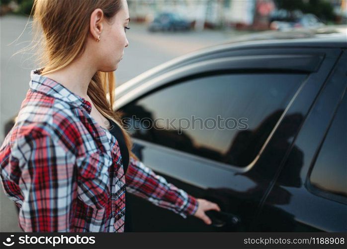 Female hand open car door, driver beginner concept. Woman at the vehicle, driving automobile. Female hand open car door, driver beginner concept