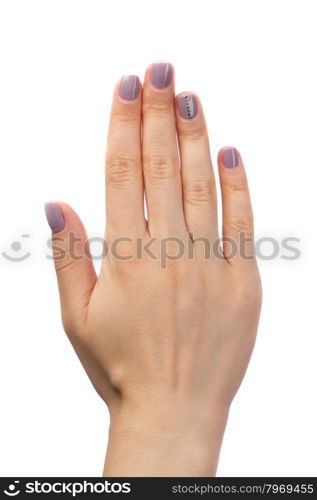 Female hand, purple manicure with rhinestones. Isolate on white.