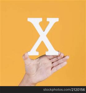 female hand showing white alphabet x