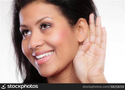 Female hand to ear listening. Gossip teen girl mixed race with palm behind ear spying. Young woman listening secret.