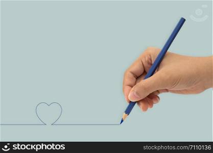 Female hand with colorful pencil isolated on white background. Minimal concept.