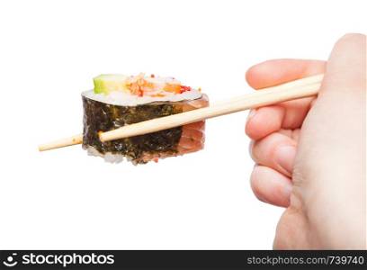 female hand with disposable chopsticks holds western-style sushi roll isolated on white background