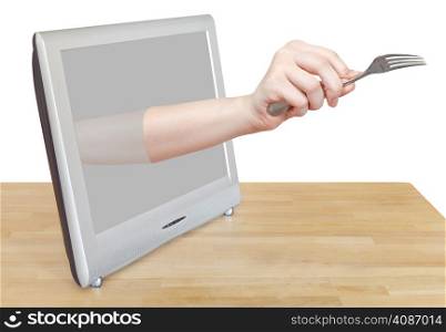 female hand with fork leans out TV screen isolated on white background