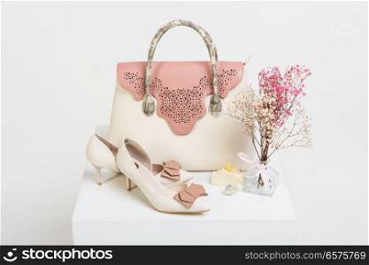 Female handbag, shoes and bouquet of dried flowers. Female handbag, shoes and bouquet of dried flowers on white background