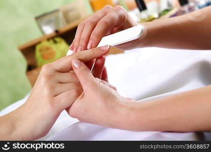 Female hands and manicure related objects in spa salon