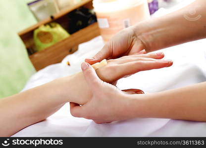 Female hands and manicure related objects in spa salon