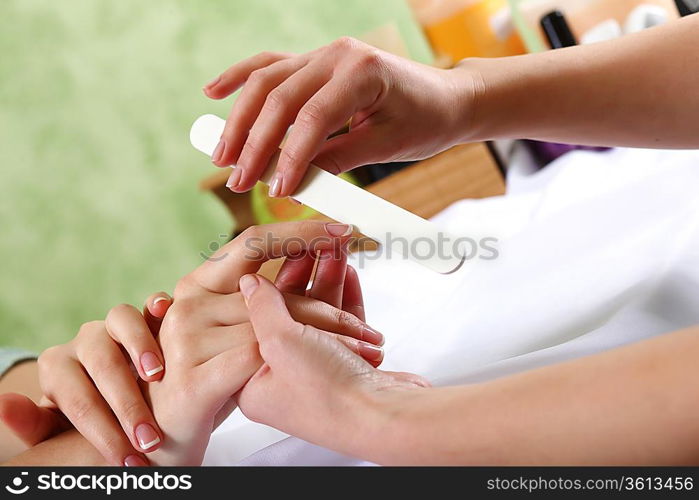 Female hands and manicure related objects in spa salon