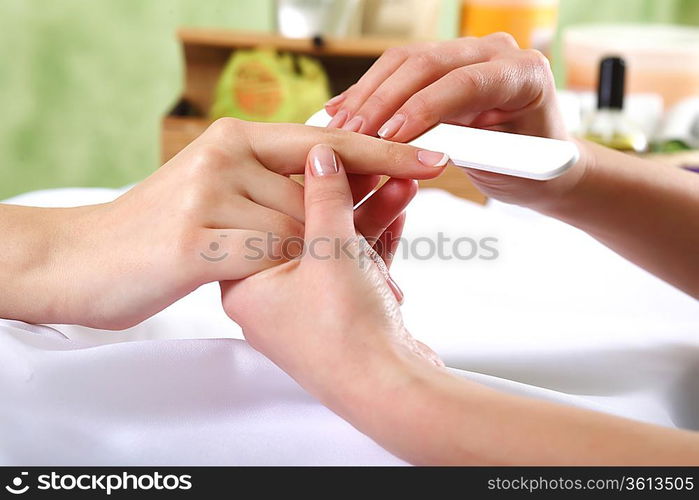 Female hands and manicure related objects in spa salon