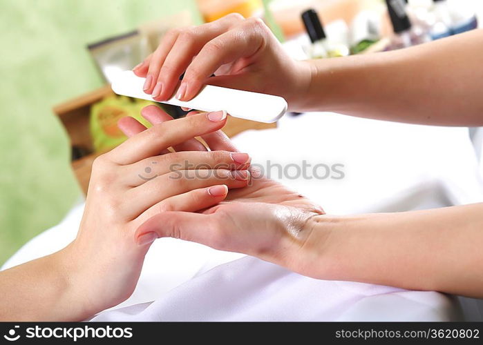 Female hands and manicure related objects in spa salon