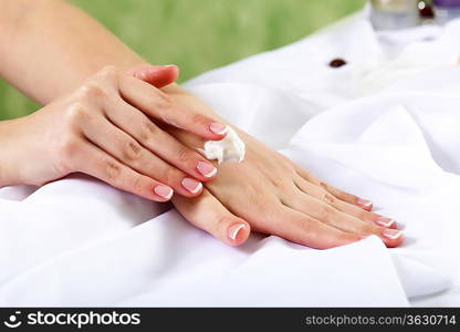 Female hands and manicure related objects in spa salon