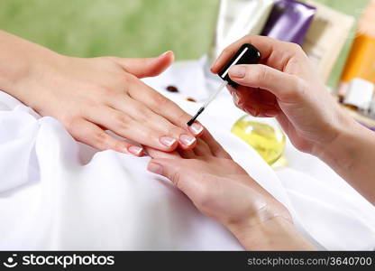 Female hands and manicure related objects in spa salon