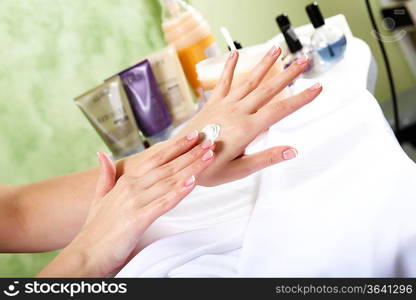 Female hands and manicure related objects in spa salon