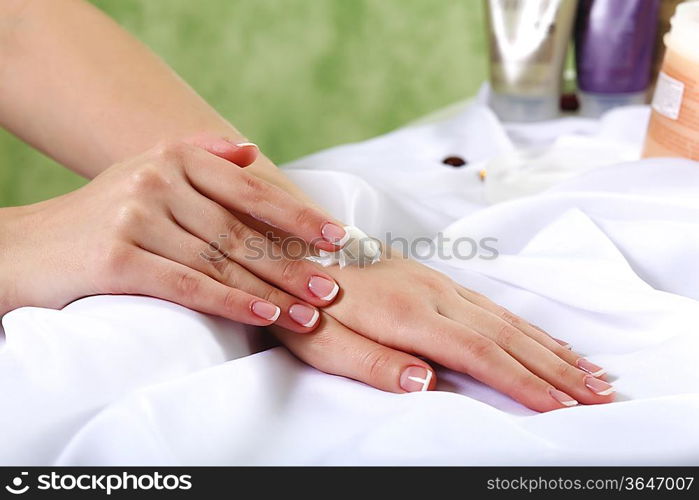 Female hands and manicure related objects in spa salon