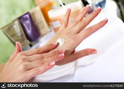 Female hands and manicure related objects in spa salon