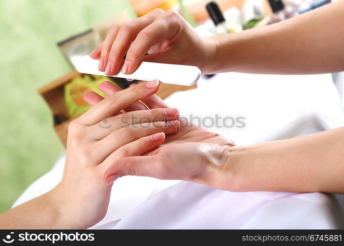 Female hands and manicure related objects in spa salon