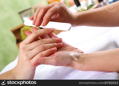 Female hands and manicure related objects in spa salon