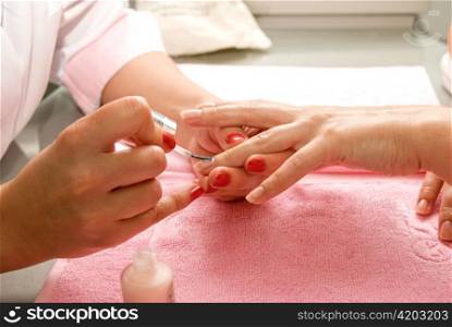 Female hands closeup at manicure process