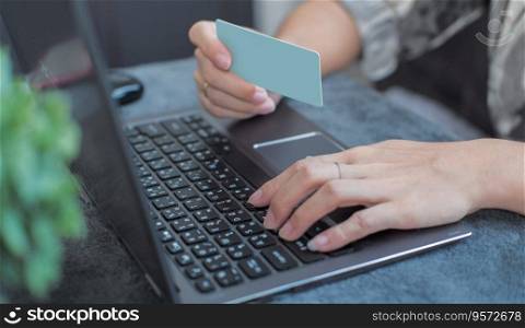 Female hands doing online shopping at home Suitable for making infographics.