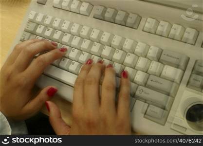 Female hands on keyboard.