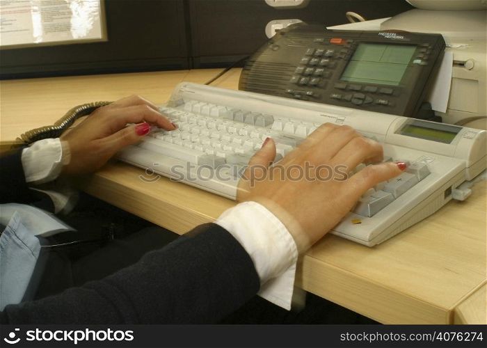 Female hands on keyboard.