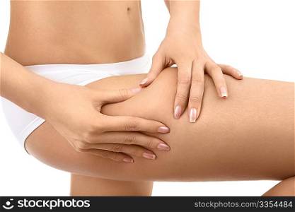 Female hands pinch on a hip a skin, isolated