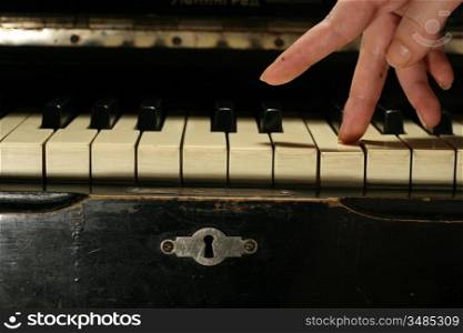 female hands playing piano closeup