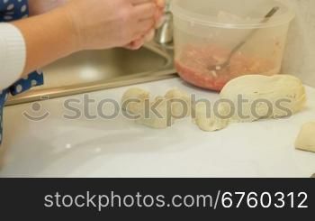 Female Hands Rolling Dough For Meat Pasty On Counter Top, Closeup