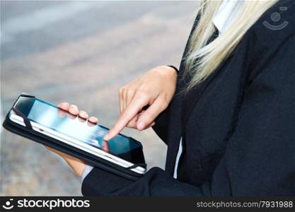female hands touching digital tablet