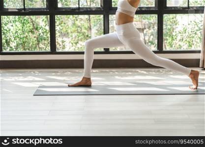 Female happiness Attractive young asian woman doing yoga stretching exercise on mat yoga   fitness exercises. Healthy lifestyle Calmness and relax at home