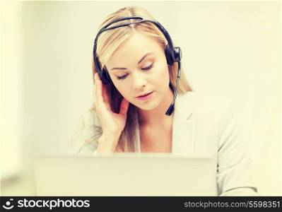 female helpline operator with headphones and laptop