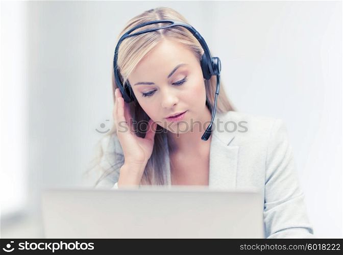 female helpline operator with headphones and laptop. female helpline operator with laptop