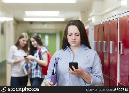 Female High School Student Bullied By Text Message In Corridor