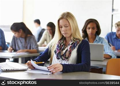 Female High School Student Studying At Desk