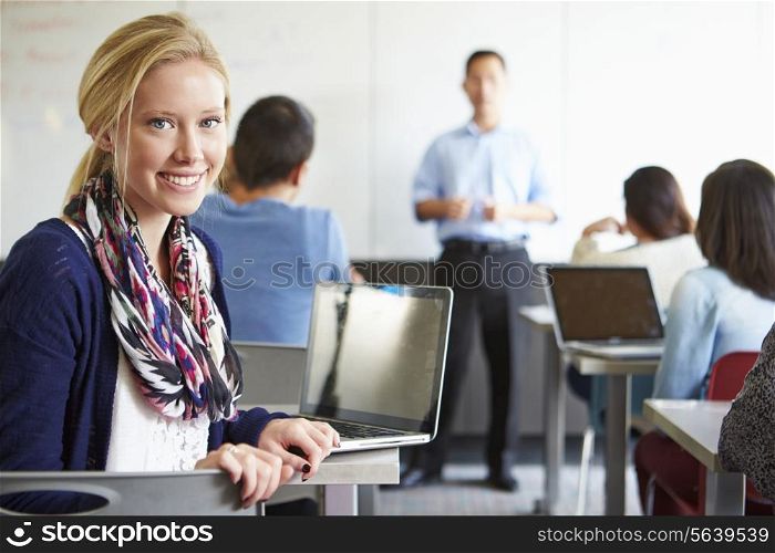 Female High School Student Using Laptop In Classroom